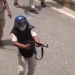 India suspends police officer for firing AK-47 at student protesters