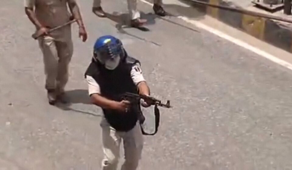 India suspends police officer for firing AK-47 at student protesters