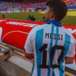 football fan wearing argentina jersey at stadium