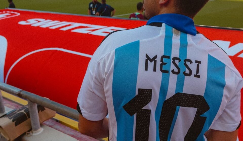 football fan wearing argentina jersey at stadium